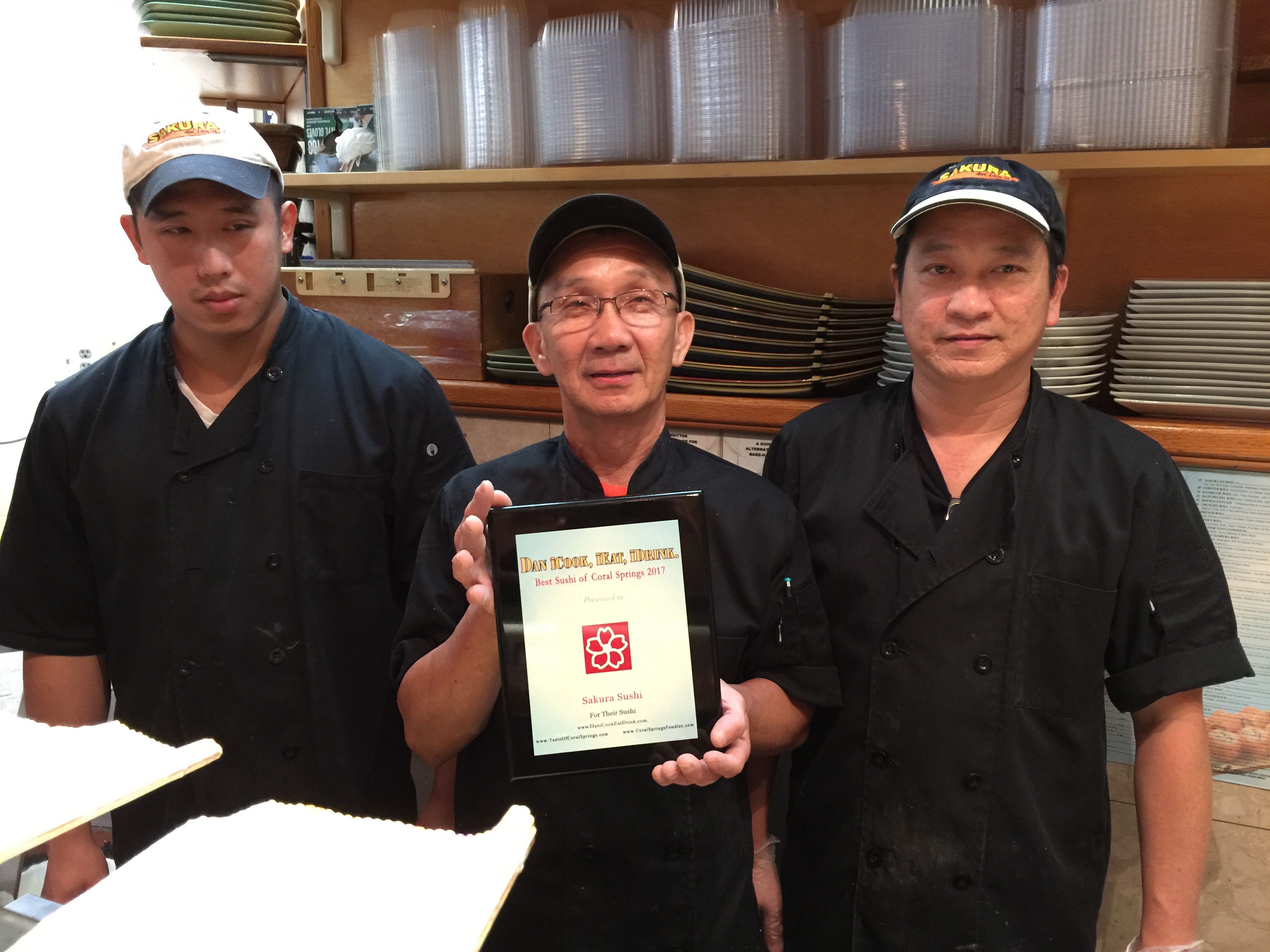Holding plaque is Owner Ming